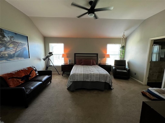 carpeted bedroom with ceiling fan, lofted ceiling, and multiple windows