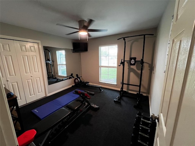 workout room featuring a healthy amount of sunlight and ceiling fan