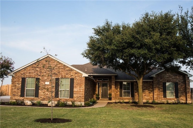 ranch-style house with a front lawn