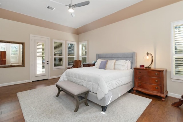 bedroom featuring dark wood-type flooring, ceiling fan, and access to exterior