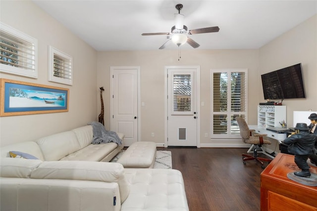 living room with ceiling fan and dark hardwood / wood-style flooring