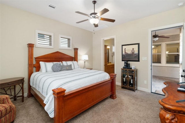 carpeted bedroom featuring ceiling fan and connected bathroom