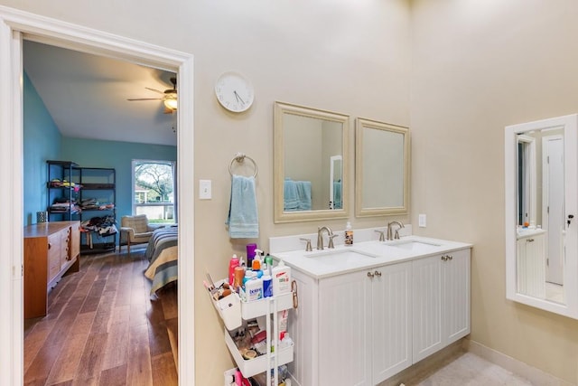 bathroom with ceiling fan, vanity, and hardwood / wood-style floors