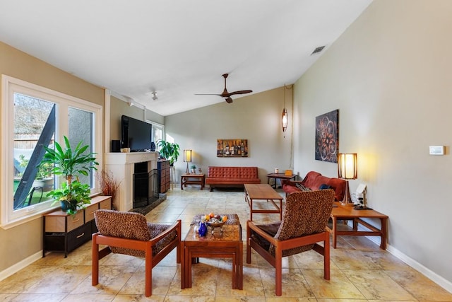 living room featuring vaulted ceiling and ceiling fan