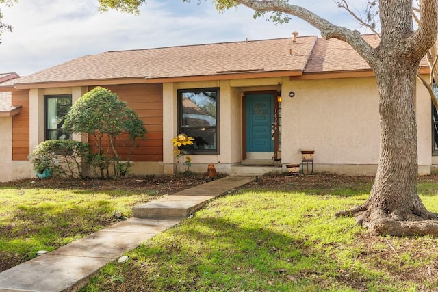 ranch-style house featuring a front yard