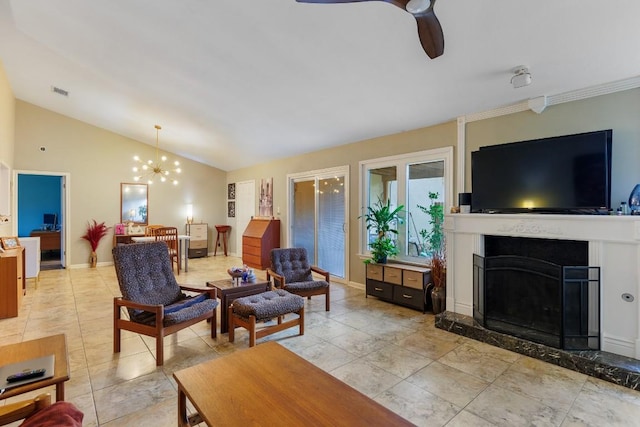 tiled living room featuring lofted ceiling and ceiling fan with notable chandelier