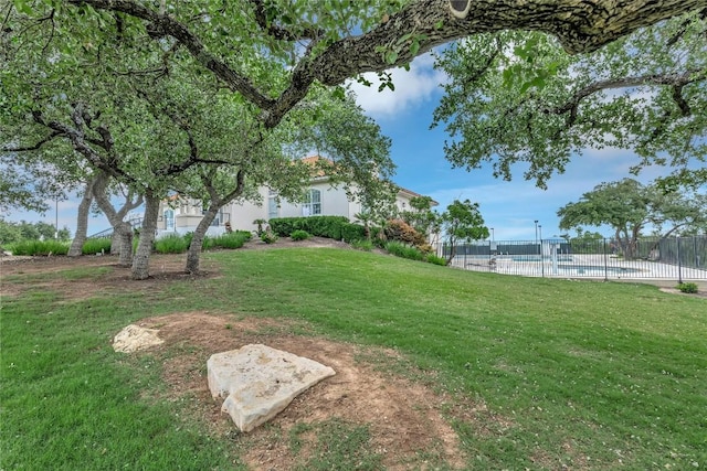 view of yard featuring a fenced in pool