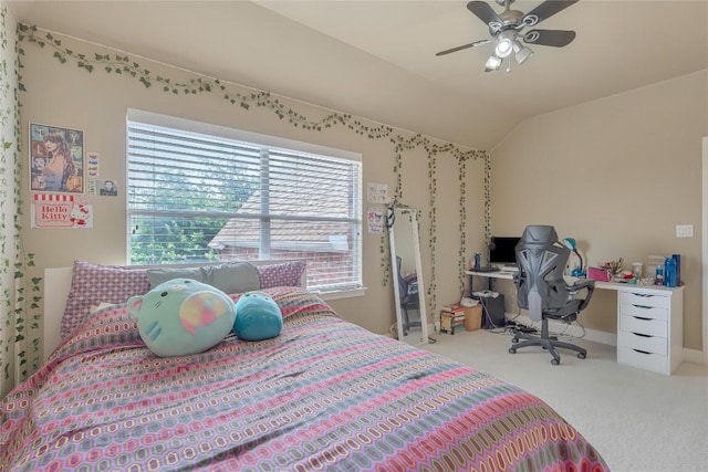 carpeted bedroom with vaulted ceiling and ceiling fan