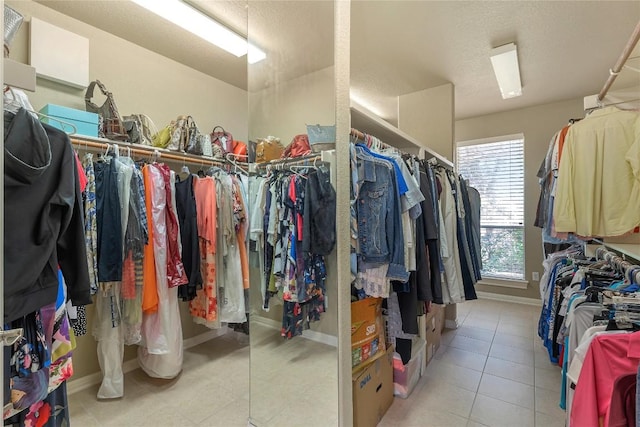 walk in closet featuring light tile patterned floors