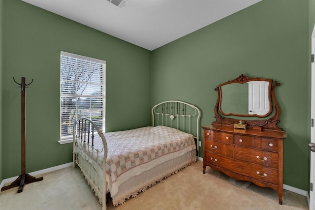 bedroom featuring light colored carpet