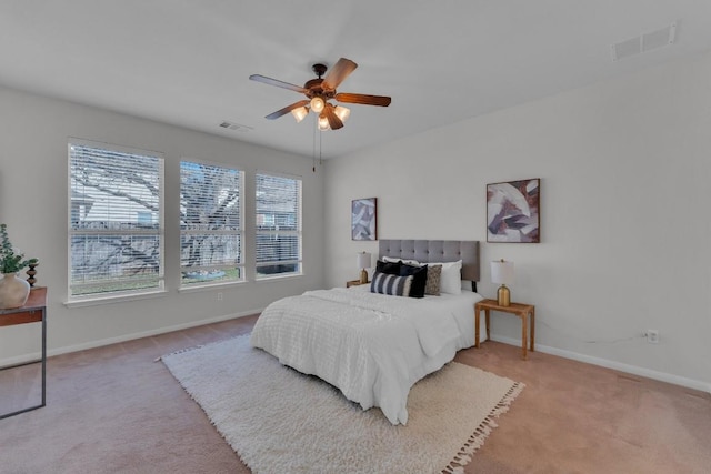 bedroom featuring ceiling fan and light colored carpet