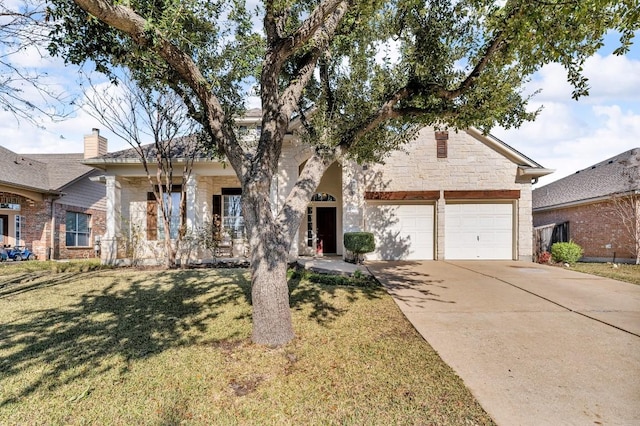 view of front of property with a garage and a front yard