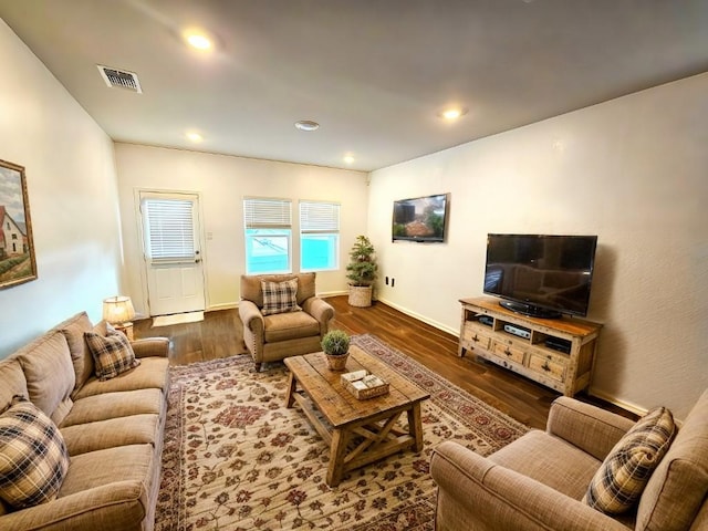 living room with dark hardwood / wood-style flooring