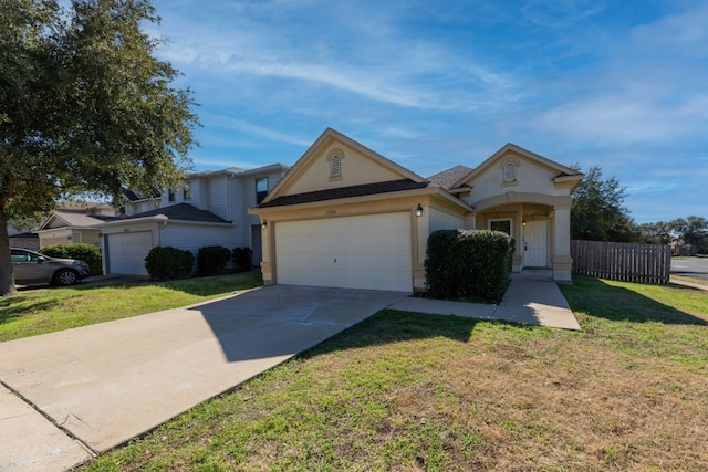 view of front of house featuring a garage and a front lawn