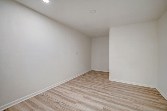 spare room featuring light hardwood / wood-style flooring