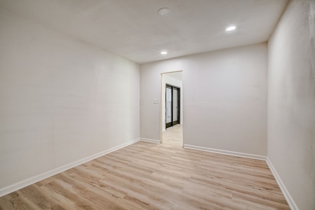 spare room featuring light wood-type flooring