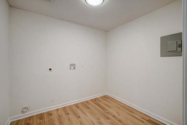 empty room with wood-type flooring and electric panel