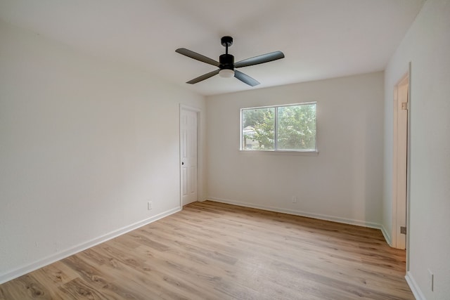 unfurnished room with ceiling fan and light wood-type flooring