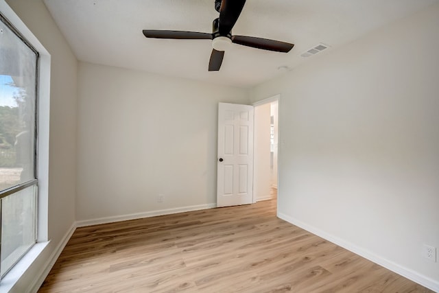 unfurnished room with ceiling fan and light hardwood / wood-style floors