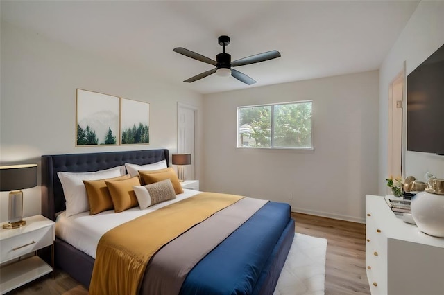 bedroom featuring hardwood / wood-style flooring and ceiling fan