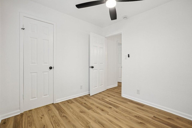 6009 Glen Meadow Dr, Austin, TX 78745 - unfurnished bedroom featuring light wood-style floors and ceiling fan