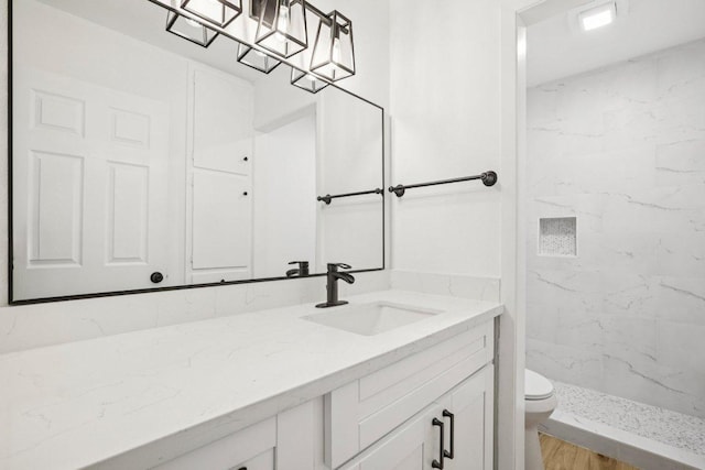 6009 Glen Meadow Dr, Austin, TX 78745 - bathroom with vanity and a marble finish shower