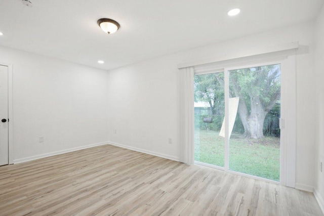 6009 Glen Meadow Dr, Austin, TX 78745 - empty room with wood finished floors and recessed lighting