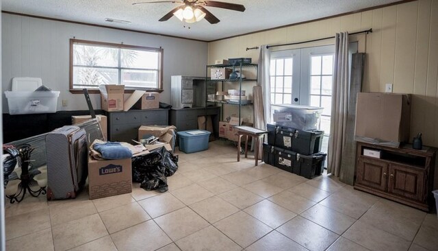 office space featuring ornamental molding, ceiling fan, a textured ceiling, and french doors