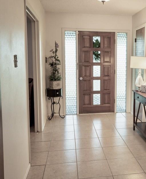 entrance foyer featuring light tile patterned floors