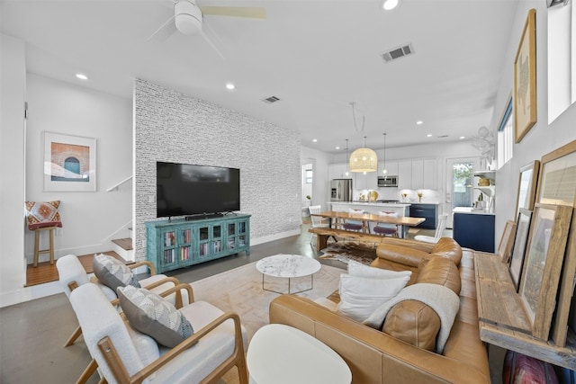 living room featuring visible vents, wood finished floors, recessed lighting, ceiling fan, and stairs