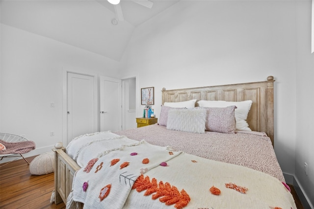 bedroom with high vaulted ceiling, wood finished floors, baseboards, and ceiling fan