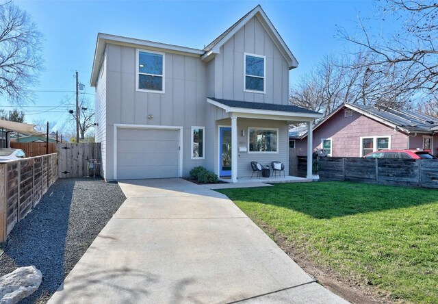 view of front of house featuring a garage, a front lawn, and a porch