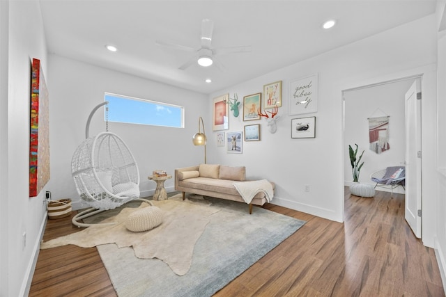 sitting room featuring recessed lighting, baseboards, and wood finished floors