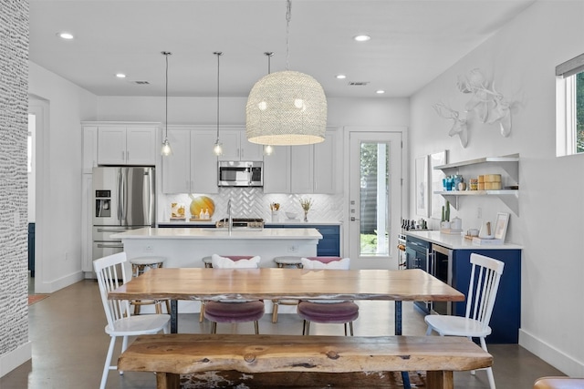 dining space featuring a wealth of natural light, visible vents, and recessed lighting