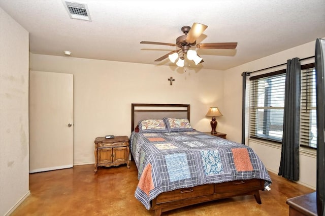 bedroom featuring a textured ceiling and ceiling fan