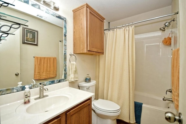 full bathroom featuring shower / bath combo, vanity, and toilet