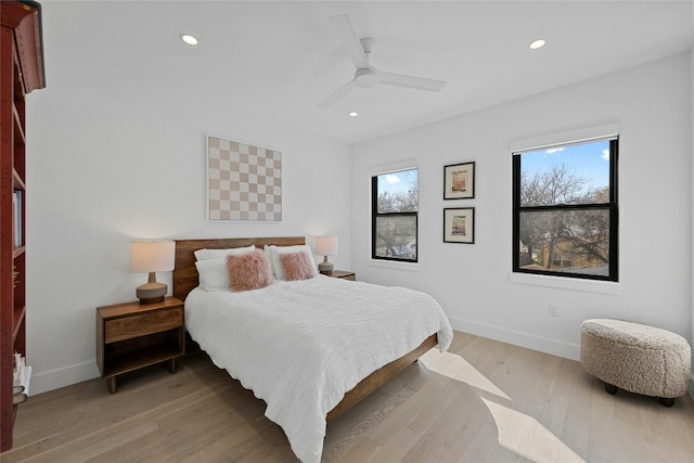 bedroom featuring ceiling fan and light wood-type flooring