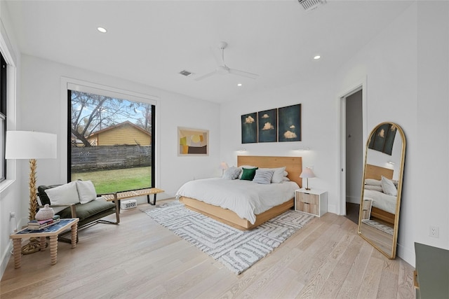 bedroom featuring ceiling fan and light hardwood / wood-style flooring