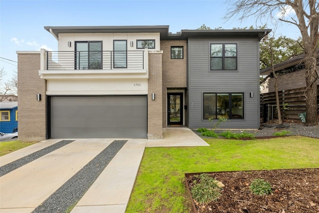 view of front facade with a garage, a balcony, and a front lawn