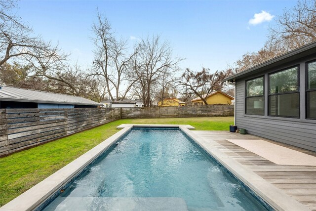 view of pool featuring a patio and a lawn