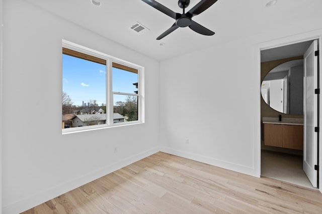 unfurnished bedroom featuring ceiling fan and light wood-type flooring