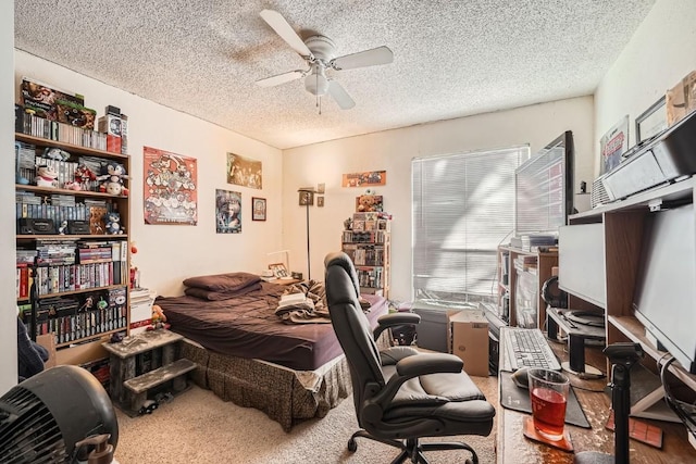 carpeted bedroom with ceiling fan and a textured ceiling