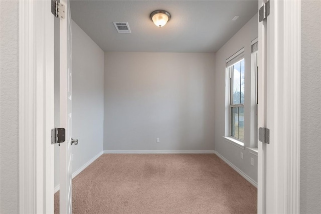 spare room with carpet floors