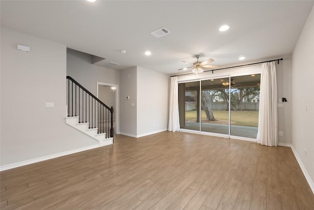 empty room with ceiling fan and wood-type flooring