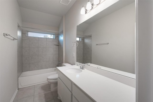 full bathroom with tile patterned floors, toilet, tiled shower / bath combo, and vanity