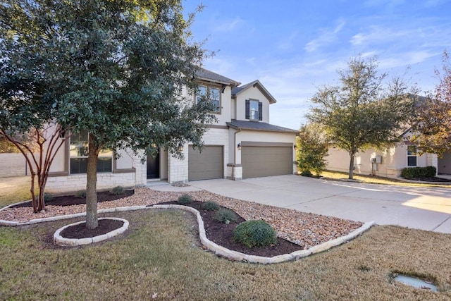 view of front of house with a garage and a front lawn