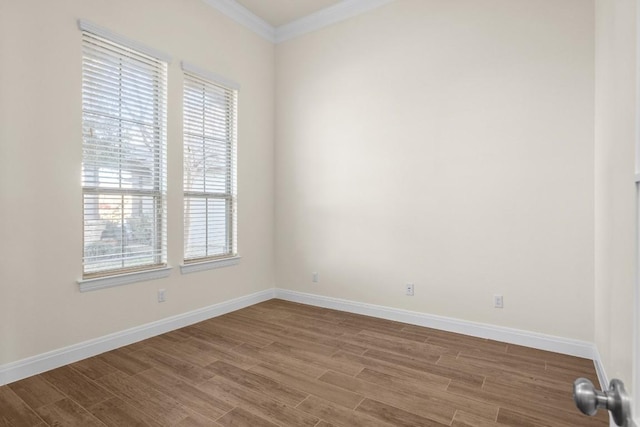 spare room with hardwood / wood-style floors and ornamental molding