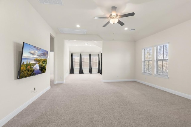 spare room with light carpet and ceiling fan