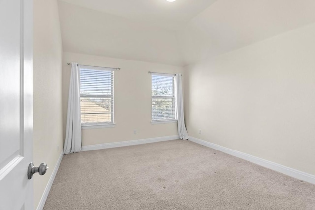 empty room featuring light colored carpet