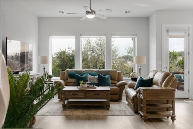 sunroom / solarium featuring ceiling fan and plenty of natural light